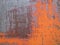 Rusty blue and orange painted detailed metal texture background.