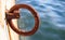 Rusty bollard waits at quay for a boat to be tied. Blur sea for background, closeup, details, banner
