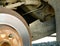 Rusty brake disc and caliper on the car. Automotive industry and garage concepts. selective focus