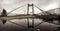 A rusty bridge hangs over the Podil Section of Kyiv or Kiev