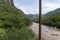 rusty cable, river and mountain in the background, vegetation barranca huentitan, guadalajara