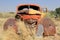 Rusty car wreck at last station in Namib desert