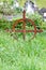 Rusty celtic grave cross in front of Muckross Abbey