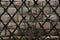 Rusty Chain Link Fence on gray background, gray and black abstract closeup of a chain link background