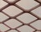 Rusty chain link fence on white backgrounds and textures closeup .