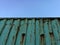 Rusty container against clear blue sky