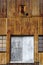 Rusty corrugated metal wall, with windows and doors, of an old building at the abandoned Grytviken whaling station