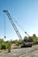 Rusty cranes in an abandoned construction site.