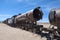 Rusty decayed train wrecks on the train cemetery near Uyuni