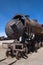 Rusty decayed train wrecks on the train cemetery near Uyuni