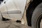 Rusty and dirty car door damaged by corrosion. Hole in the door car. Negligent attitude to the car. Lack of