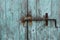 Rusty door bolt sliding latch on wooden gate