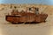 Rusty fishing boat lying in the sand