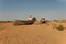 Rusty fishing boats lying in the sand