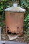 Rusty garden incinerator on home allotment for burning green waste stock photo