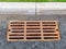 Rusty grate of drain system on new city road