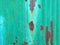 Rusty green mint metal wall with brown patterns. metal rust texture background