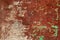 Rusty and grungy metal iron plate wall with the typical ferric oxide red color and with green peeling coating texture background