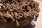 Rusty iron chain in cankered bucket, outdoor under sunlight