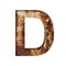 Rusty iron letters. The letter D cut out of paper on the background of an old rusty iron sheet with rust stains and cracks.
