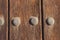 Rusty iron ornaments and trim on old wooden doors on the outside