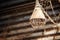 Rusty lamp hanging from ceiling with spiderwebs