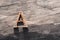 Rusty letter A sign lying on a wood texture in warm light