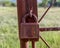 A rusty lock hangs on an old iron wicket.