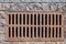 Rusty manhole rectangular grating of the drainage system.