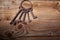 Rusty medieval keys on wood table