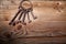 Rusty medieval keys on wood table