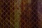 Rusty mesh background texture. Stock photo focus on a rusty sect of the fence