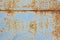 Rusty metal background . Corroded metal sheet with paint residue. Rust on an old metal background