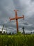 Rusty metal gravestone cross