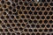 Rusty metal iron pipes, background texture. A pile of metal pipes end view, round rusty sections of iron structures, building