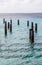 Rusty Metal Pilings in Harbor