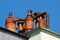Rusty metal pipes and chimneys on a roof
