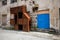 Rusty metal structure next to a blue door in Labin, Istria, Croatia