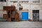 Rusty metal structure next to a blue door in Labin, Istria, Croatia