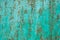 Rusty metal texture and turquoise paint close up