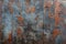 Rusty metal wall background with weathered texture and paint remnants