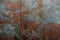 Rusty metal wall background with weathered texture and paint remnants