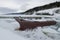 Rusty mooring cleat on an icy North Atlantic wharf