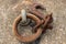Rusty mooring hook for boat on concrete