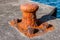 Rusty old bollard on the dock of some harbour in Pico-Azores.