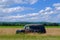 Rusty Old Car in Farm Field