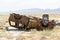 Rusty old car upside down dumped in the desert