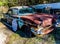 Rusty, old, junked car in the woods