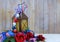 A rusty old lantern decorated with red, white and blue USA patriotic stars and stripes ribbons