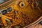 Rusty old nuts and bolts in a rustic wooden box on a workbench, industrial close up concept